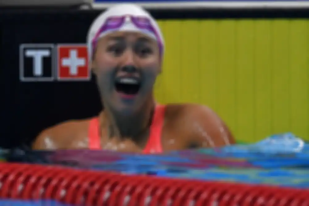 Perenang Cina Liu Xiang meluapkan kegembiraannya usai menjadi pemenang babak final 50 meter Gaya Pun