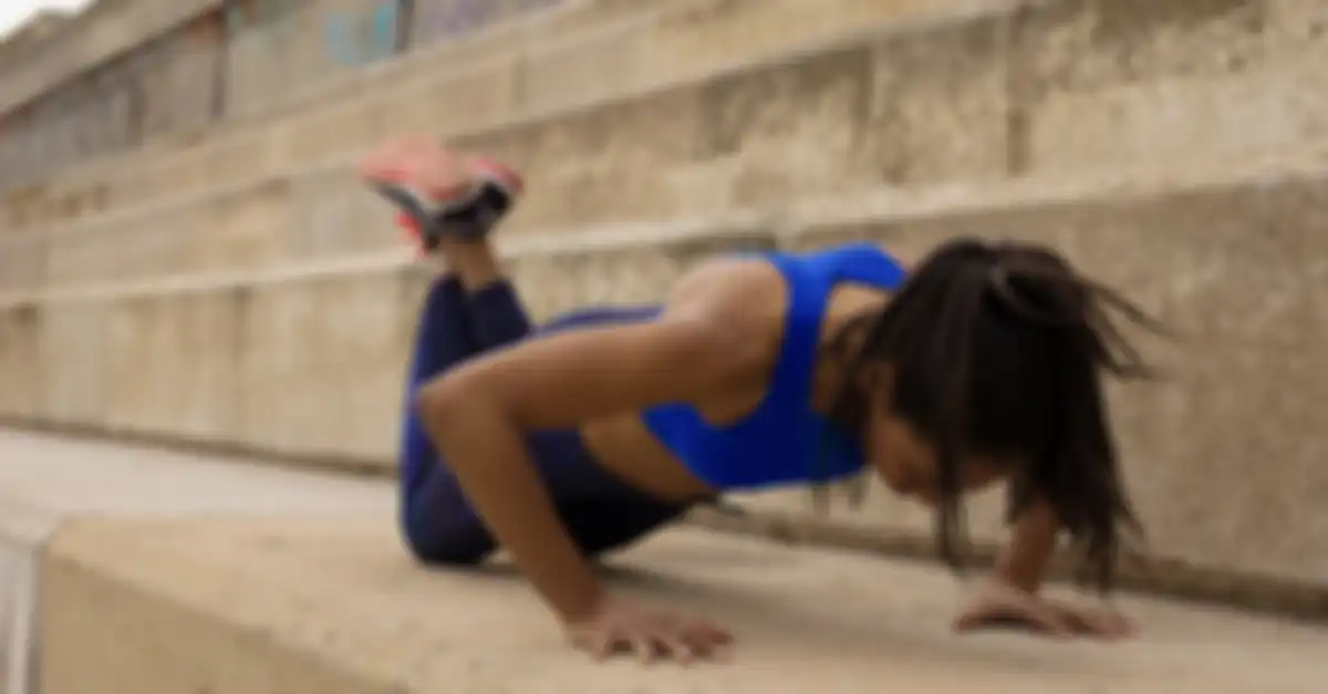 Black Sportswoman Push-ups On Step
