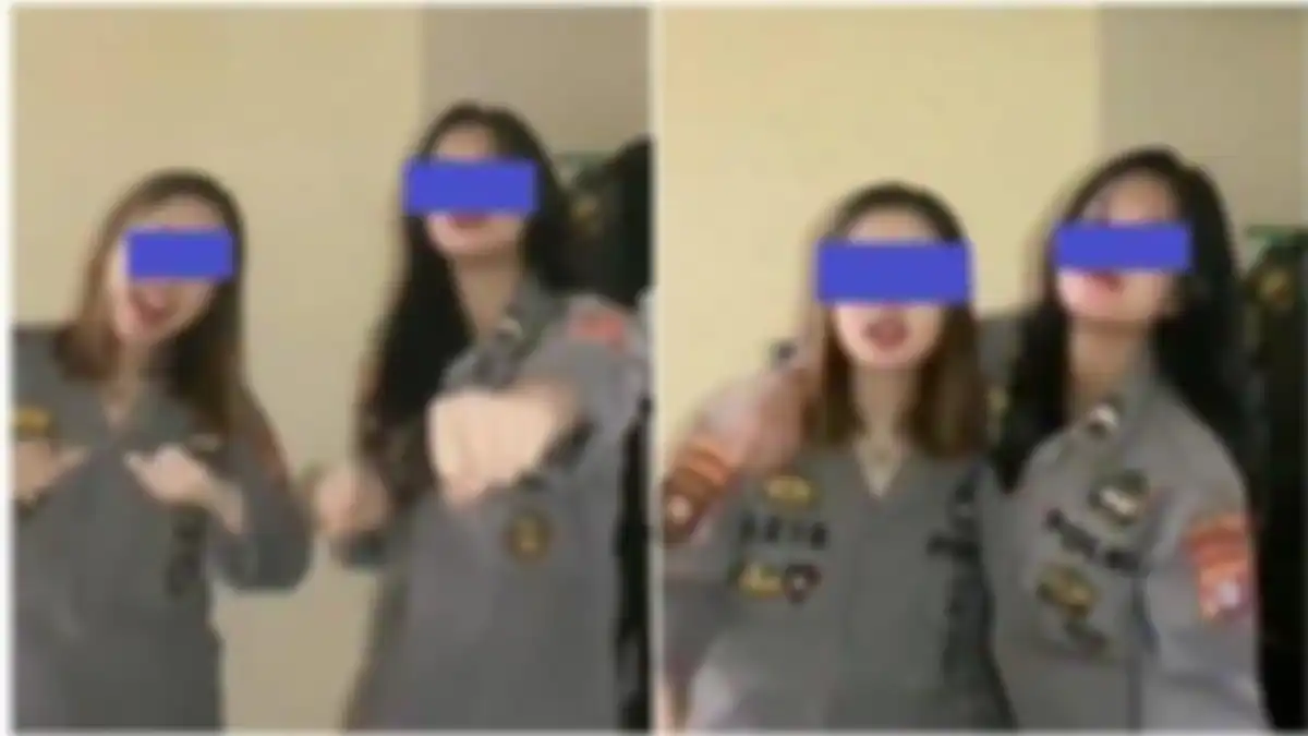 Tangkapan layar unggahan video memperlihatkan dua wanita berjoget ajojing mengenakan pakaian dinas Polri dan celana pendek. 