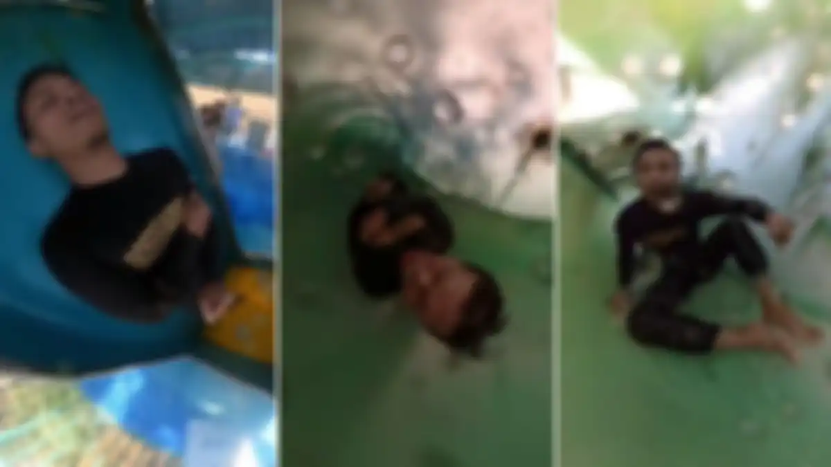 Pria tersangkut di perosotan air hingga ketakutan. 