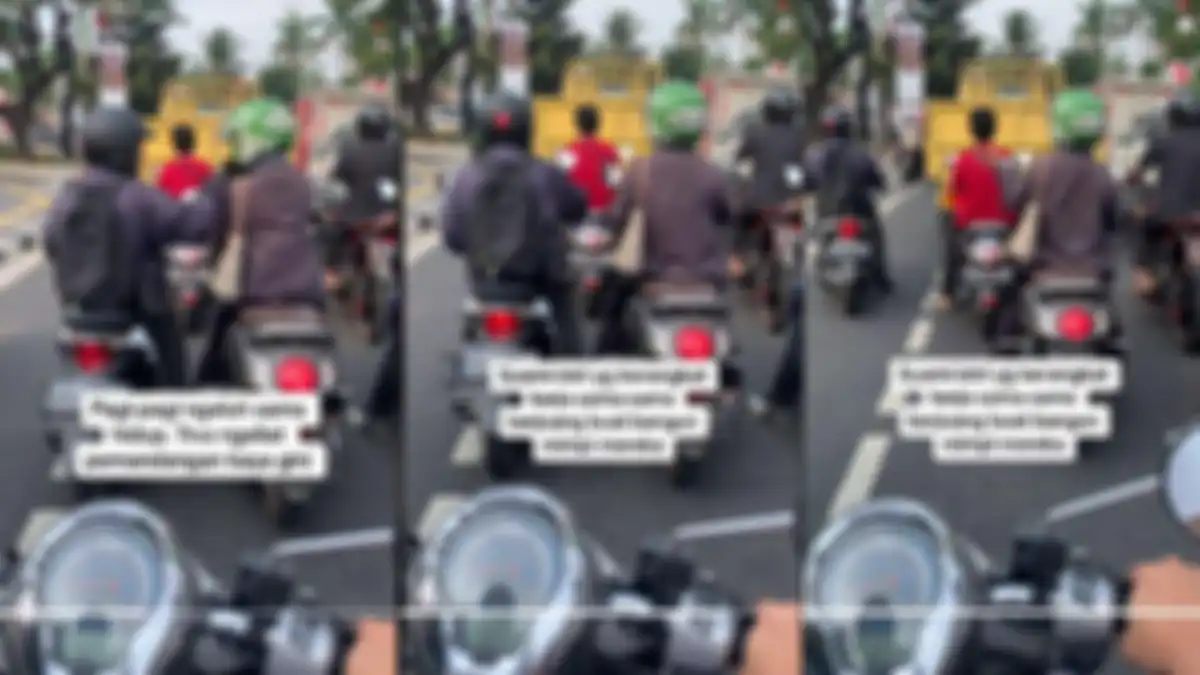 Momen mesra pasangan suami istri pamit cium tangan di lampu merah sebelum berangkat kerja.
