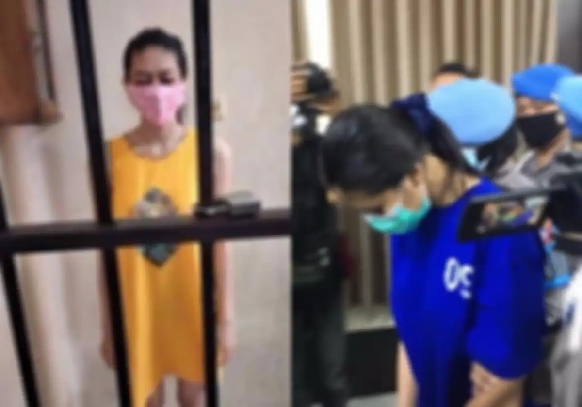 Nani Apriliani Nurjaman, 25, alias Tika tertunduk saat berada di dalam tahanan dan dihadirkan dalam rilis pers di Aula Wirapratama, Polres Bantul, Senin (3/5/2021)
