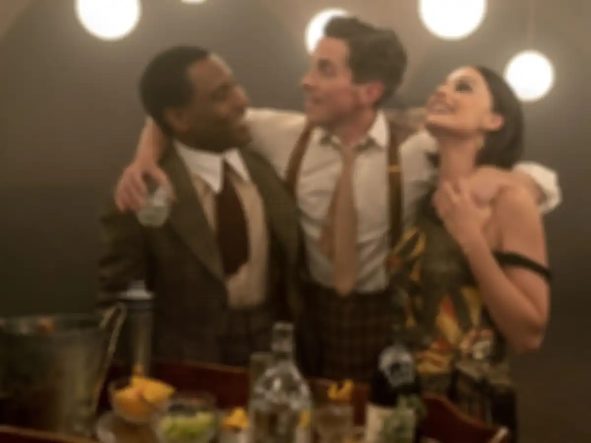(L-R): John David Washington as Harold, Christian Bale as Burt, and JMargot Robbie as Valerie in 20th Century Studios AMSTERDAM. Photo by Merie Weismiller. © 2022 20th Century Studios. All Rights Reserved.