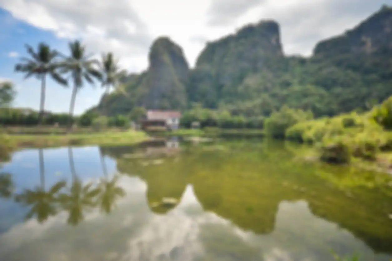 Beautiful limestones and water reflections in Rammang Rammang park near Makassar, South Sulawesi, In