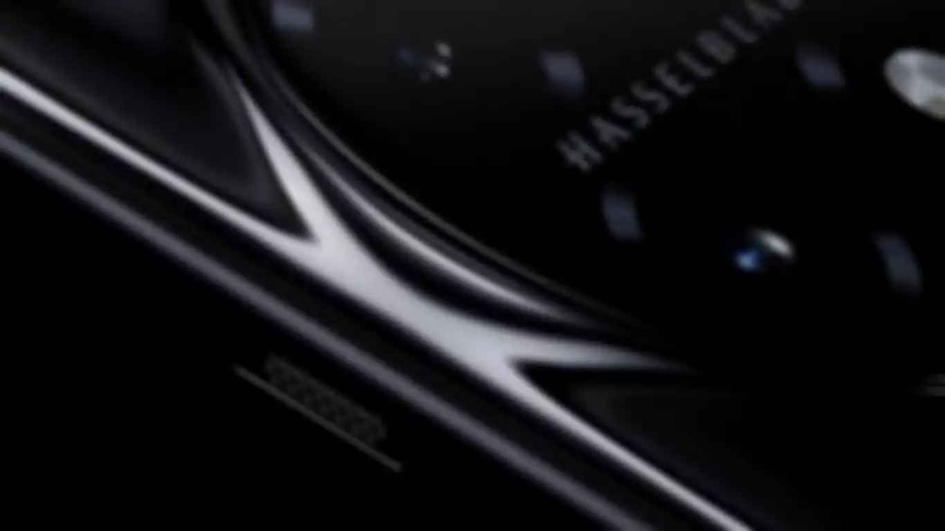 Tombol geser dan Logo Hasselblad pada teaser resmi OnePlus 11