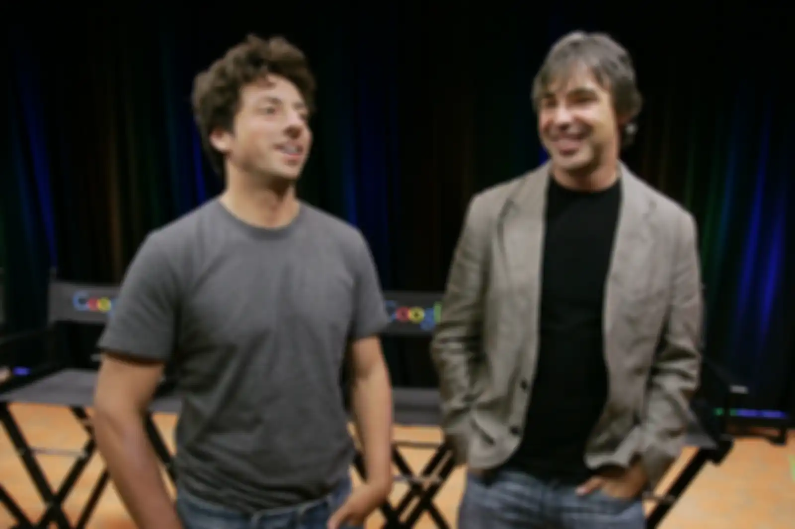 FILE - In this Sept. 2, 2008 file photo, Google co-founders Sergey Brin, left, and Larry Page talk during a new conference at Google Inc. headquarters in Mountain View, Calif. Brin and Page have always said they put their principles before profit, even to the point of using their control of the comp