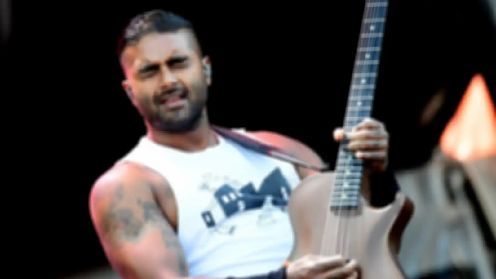 Guitarist of the Canadian SUM 41 rock band Dave Baksh performs on the main stage at the 