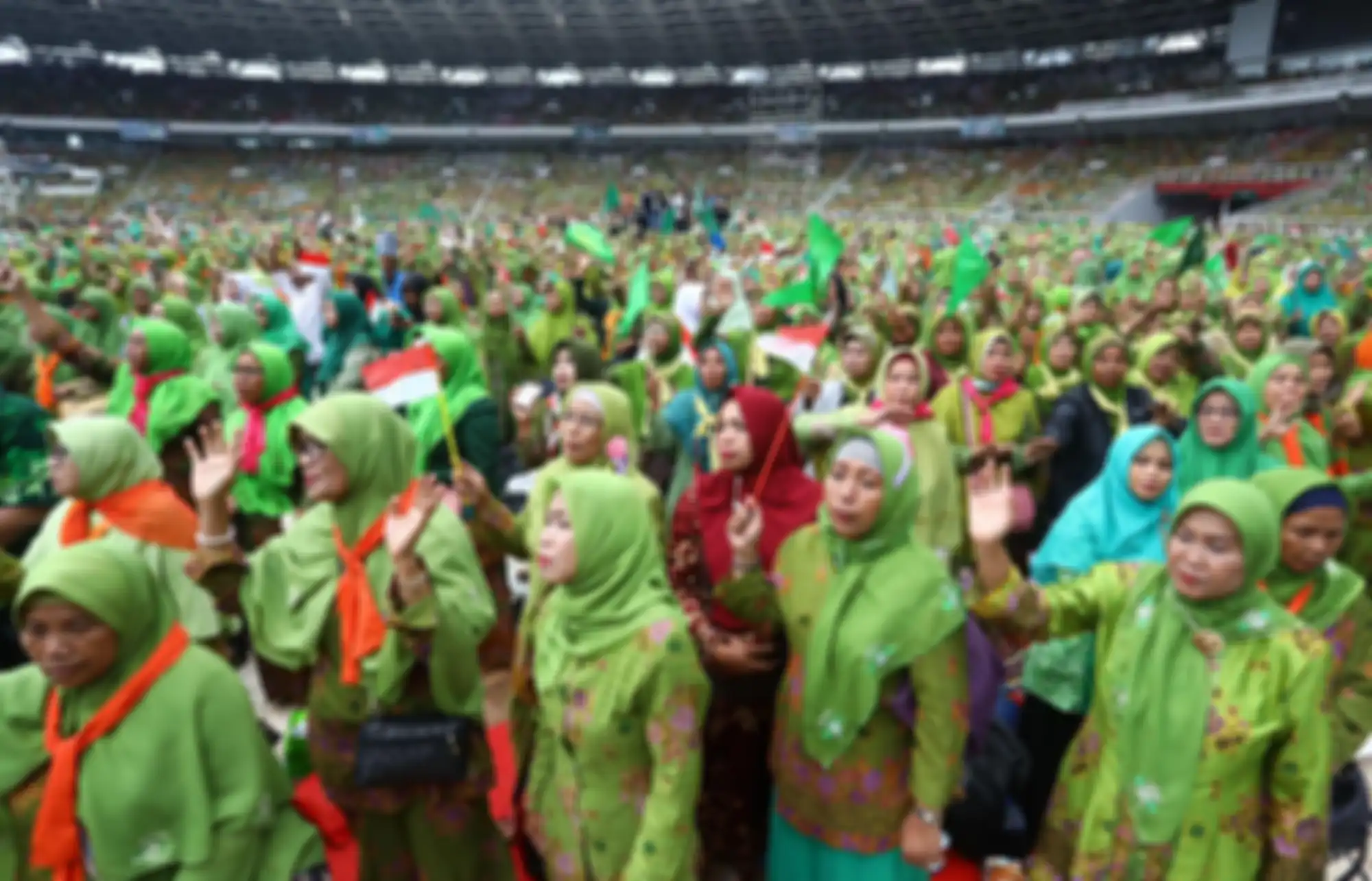 Peserta dari Muslimat NU mengikuti Harlah ke 73 Muslimat NU, doa bersama untuk keselamatan bangsa dan maulidurrasul, di Stadion Utama Gelora Bung Karno, Senayan, Jakarta, Minggu (27/1/2019). Acara tersebut mengangkat tema Khidmah Muslimat NU, Jaga Aswaja, Teguhkan Bangsa. TRIBUNNEWS/IRWAN RISMAWAN