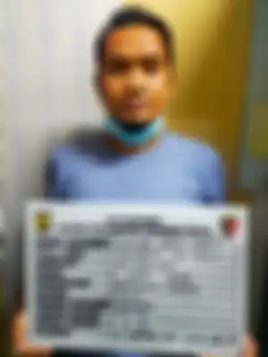 Foto tampang koordinator pungutan liar (pungli) di kawasan JICT, Pelabuhan Tanjung Priok, Jakarta Utara yang dicokok polisi. 