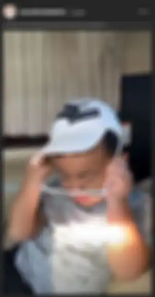 Magika saat memakai topi dari brand ternama