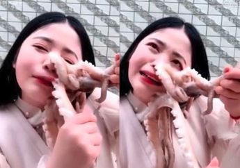 Nekat Coba Kuliner Ekstrem dengan Makan Gurita Hidup-hidup, Wanita Tiongkok ini Alami Hal Mengerikan