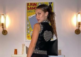 Meski Hanya Duduk Santai Sambil Meluk Kambing, Bella Hadid Tetap Tampil Cetar dengan Gaun Seharga Rp 41 Juta