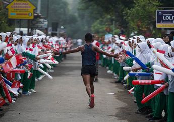 Para Pelari Berpesta dalam Semarak Sambutan Warga
