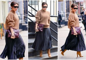 Gaya Fashion Baru Victoria Beckham yang Khas dengan Turtleneck Sweater dan Rok Lipit 