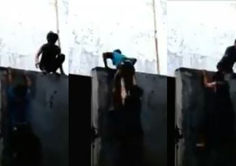 Kocak, Aksi Saling Bantu Panjat Tembok Dua Pria Ini Bikin Netizen Gregetan