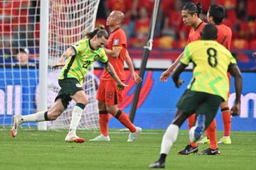 Pemain Australia, Jackson Irvine, merayakan gol yang dicetaknya ke gawang China di Kualifikasi Piala Dunia 2026, Selasa (25/3/2025) di Huangzhou.