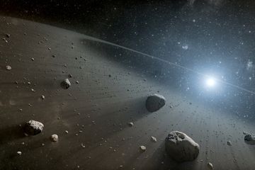 Ilustrasi seniman tentang sabuk asteroid.