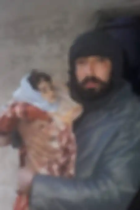 Ahmad Yassin Leila dan putrinya yang masih bayi, Iman, yang mati kedinginan.