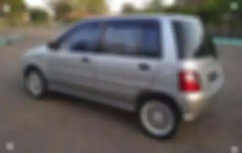 Daihatsu Ceria generasi kedua yang mulai munci 2003 cirinya bodi rada membulat dan lampu utama juga bulat