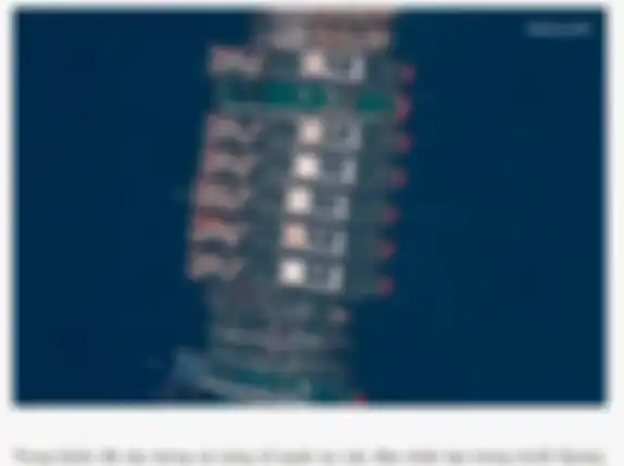 Citra Setalit menunjukkan kapal China berlabuh di Whitsun Reef yang terletak di Laut China Selatan yang disengketakan.