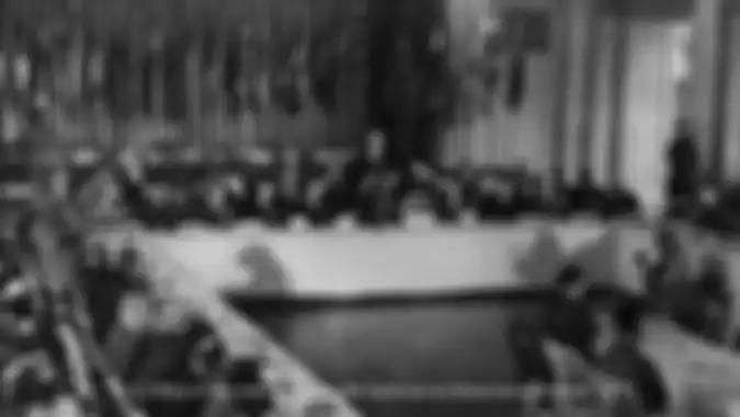 Bretton Woods Monetary Conference - The U.S. Secretary of the Treasury, Henry Morgenthau, Jr., addresses the delegates to the Bretton Woods Monetary Conference, July 8, 1944 (Credit: U.S. Office of War Information in the National Archives).