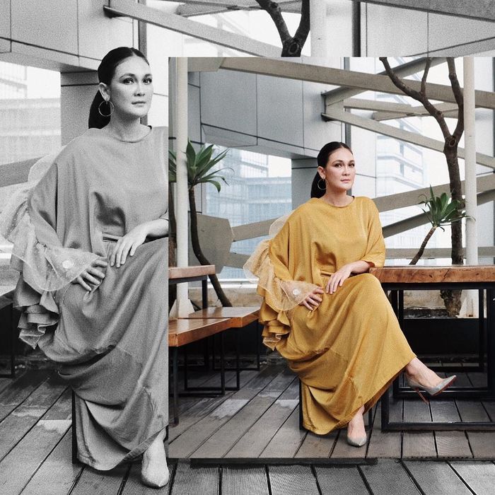 Luna Maya terlihat mengenakan kaftan berwarna kuning