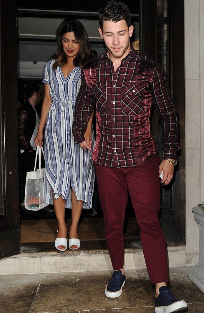 Priyanka Chopra tampak mengenakan striped shirt dress