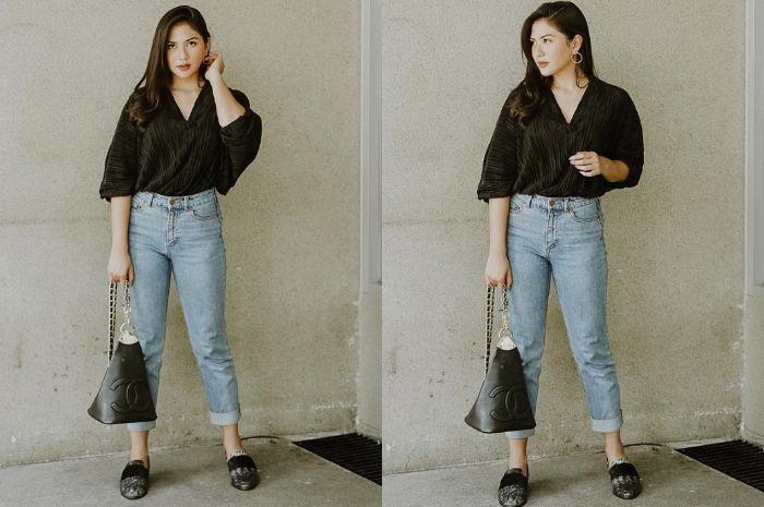 Jessica Mila tampil dengan v-neck blouse berwarna hitam yang memiliki model lengan bat wing
