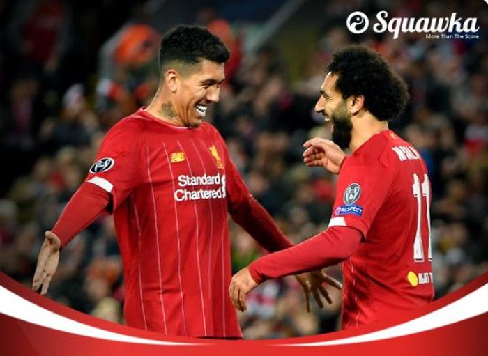 Duo penyerang Liverpool, Roberto Firmino dan Mohamed Salah, merayakan gol yang dicetak ke gawang Salzburg dalam laga Grup E Liga Champions di Stadion Anfield, Rabu (2/10/2019).