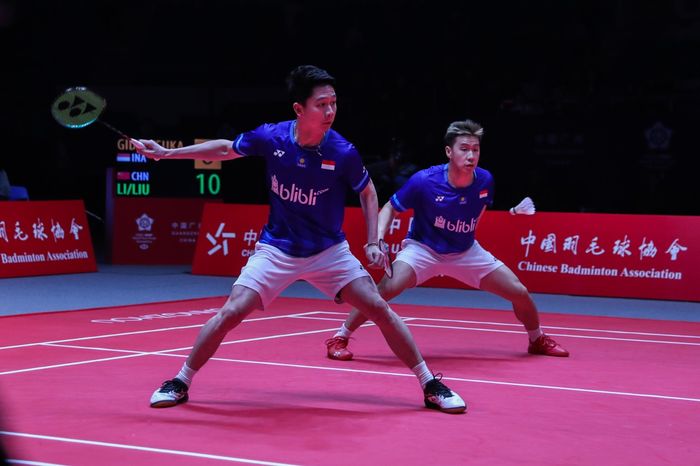 Aksi ganda putra Indonesia, Marcus Fernaldi Gideon/Kevin Sanjaya Sukamuljo pada ajang BWF World Tour Finals 2019