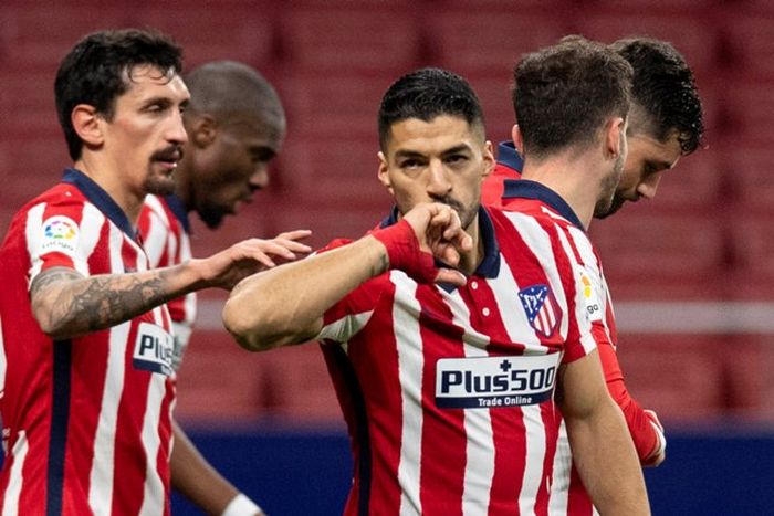 Luis Suarez merayakan golnya untuk Atletico Madrid.