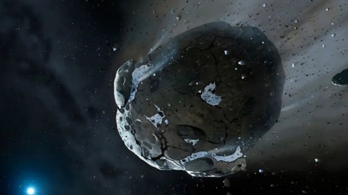 Ilustrasi tentang asteroid berair yang mengarah ke bintang kerdil putih.