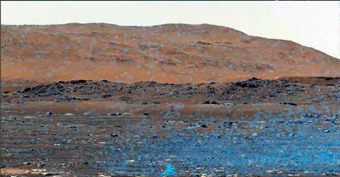 Tangkapan layar dari rekaman video debu-debu yang beterbangan selama penerbangan helikopter di Mars.