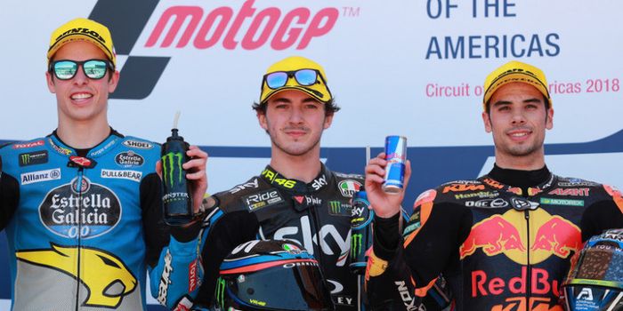 Alex Marquez, Francesco Bagnaia, dan Miguel Oliveira, saat merayakan podium GP Americas 2018.