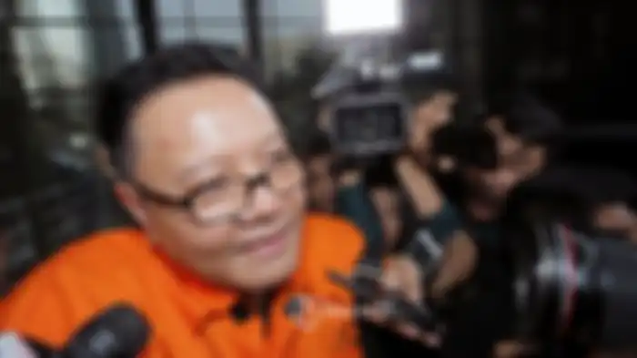 Anggota DPR RI I Nyoman Dhamantra mengenakan rompi tahanan usai menjalani pemeriksaan di Gedung KPK, Jakarta, Jumat (9/8/2019).
