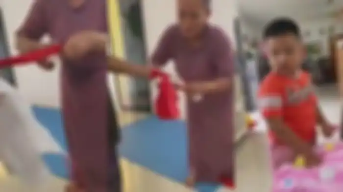 Aksi seorang emak-emak gunting bendera merah putih, viral di media sosial.