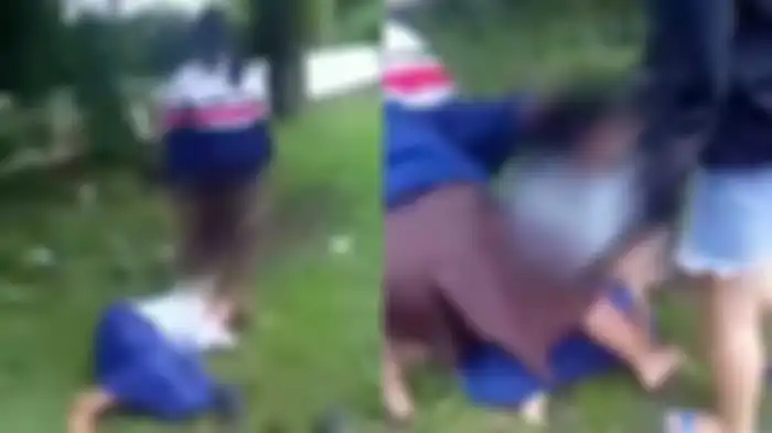 Tangkapan layar video viral bullying gadis di Kota Malang. Dalam video yang berdurasi 2 menit 29 detik itu, terlihat seorang gadis remaja dipukuli dan ditendangi oleh beberapa remaja perempuan, Kamis (18/11/2021). 