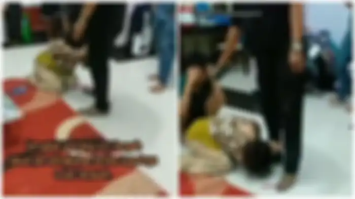 Sang istri sujud di kaki suaminya, sementara pria diduga selingkuhannya nunduk malu