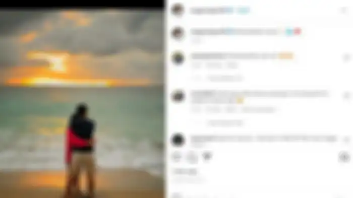 Angga Wijaya membagikan potretnya bersama seorang wanita di pantai. 