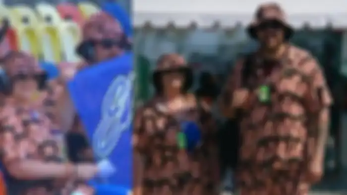 Pasangan yang ternyata fans Fabio Quartararo ini memakai outfit dengan motif penuh wajah sang idola.