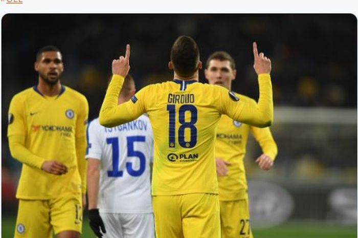 Striker Chelsea, Olivier Giroud, merayakan gol yang dicetak ke gawang Dynamo Kyiv dalam laga leg kedua babak 16 besar Liga Europa di Stadion NSK Olimpiyskyi, Kamis (14/3/2019).