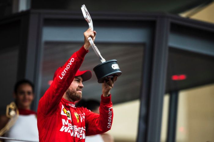 Pembalap Ferrari, Sebastian Vettel lakukan selebrasi usai finis di urutan dua pada F1 Monako 2019, Minggu (26/5/2019)