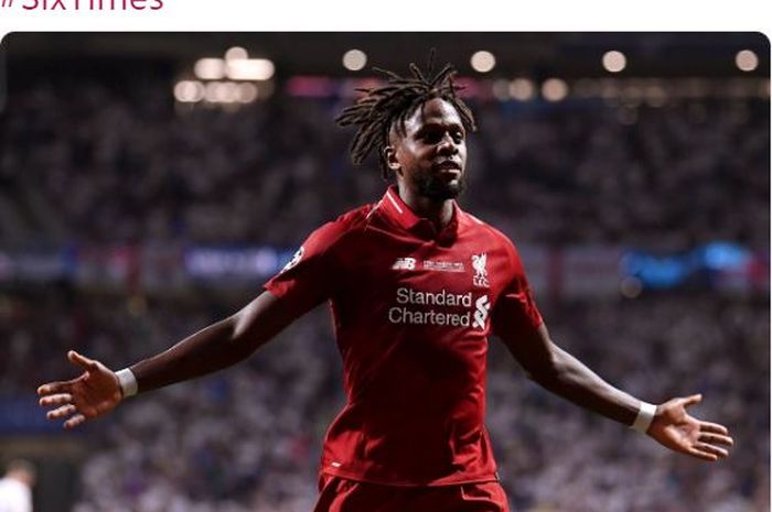 Penyerang Liverpool, Divock Origi, merayakan gol ke gawang Tottenham Hotspur dalam laga final Liga Champions di Stadion Wanda Metropolitano, Sabtu (1/6/2019).