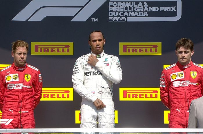 Dari kiri ke kanan, Sebastian Vettel, Lewis Hamilton, Charles Leclerc di podium Formula 1 GP Kanada di Sirkuit Gilles Villeneuve, Minggu (9/6/2019).