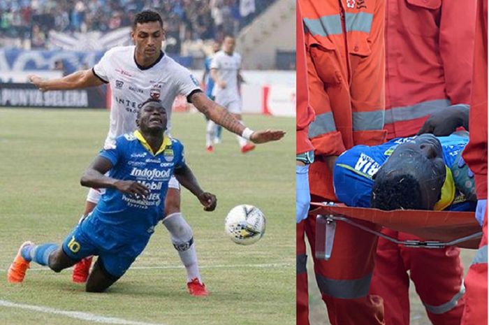 Striker Persib Bandung Ezechiel N'Douassel ditekel bek Madura United Jaimerson da Silva dalam Liga 1 2019 di Stadion Si Jalak Harupat, Kabupaten Bandung, Minggu (23/6/2019). Ezechiel (kanan) ditandu usai berbenturan dengan bek Madura United Andik Rendika Rama.