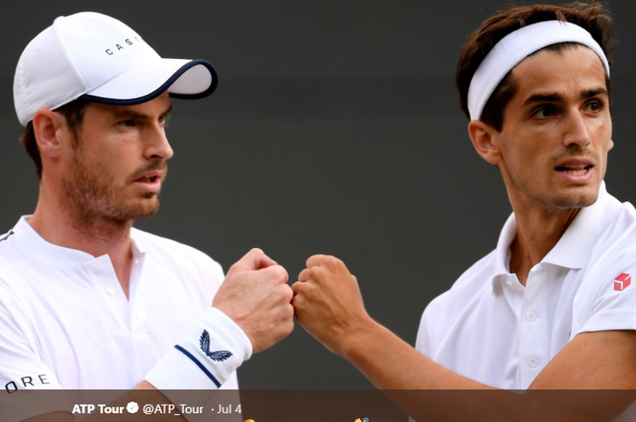 Andy Murray (kiri)/Pierre-Hugues Herbert (Britania raya/Prancis) saat melakoni laga babak pertama Wimbledon 2019, Jumat (5/7/2019), di All England Club, Wimbledon, London.