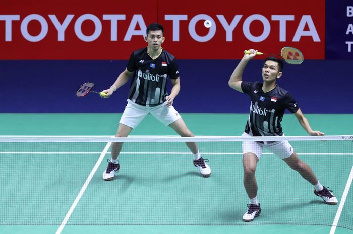 Pasangan ganda putra Indonesia, Muhammad Rian Ardianto (kiri) dan Fajar Alfian, pada babak pertama Thailand Open 2019 di Indoor Stadium Huamark, Bangkok, Selasa (30/7/2019).