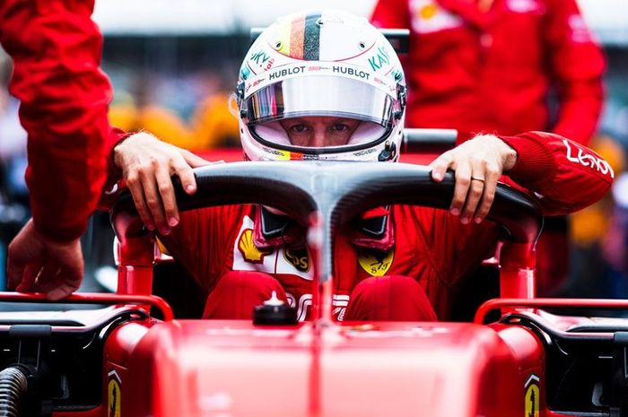 Pembalap Ferrari, Sebastian Vettel saat melakukan persiapan untuk babak kualifikasi F1 Hungaria 2019, Sabtu (3/8/2019)