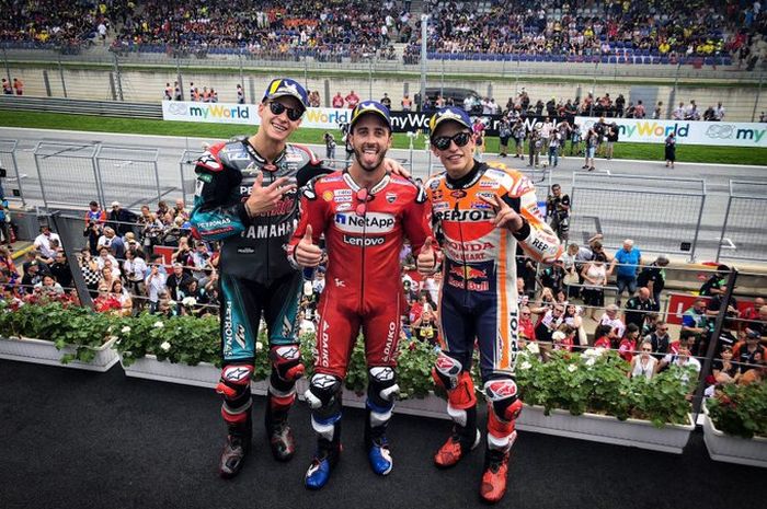 Fabio Quartararo (Petronas Yamaha SRT), Andrea Dovizioso (Ducati), dan Marc Marquez (Repsol Honda) berpose di podium MotoGP Austria di Red Bull Ring, Spielberg, Minggu (11/8/2019).