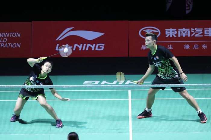 Pasangan ganda campuran Indonesia, Rinov Rivaldy/Pitha Haningtyas Mentari, pada babak pertama Fuzhou China Open 2019 di Olympic Sports Center, Fuzhou, China, Selasa (5/11/2019).